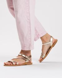 Φωτογραφία από Niki Gold leather sandals